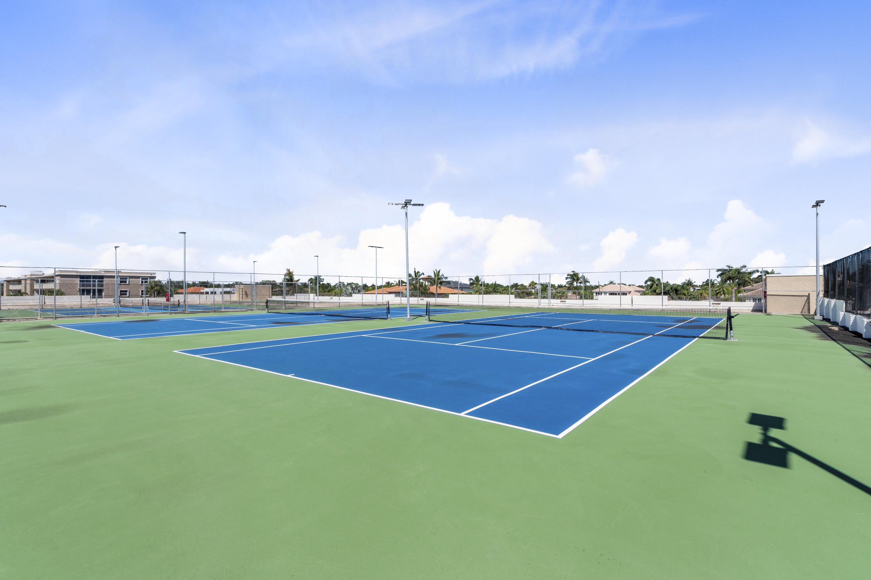 859 Jeffery Street, Unit 312 Boca Raton, FL 33487 - Photo 42 of 53 a view of a tennis court
