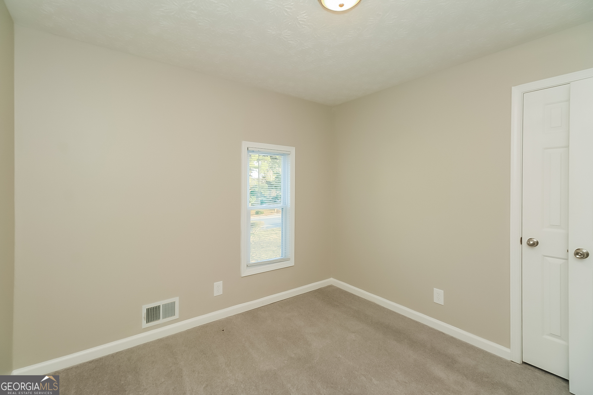 2875 Kathryn Circle Southwest Atlanta, GA 30331 - Photo 11 of 18 an empty room with windows