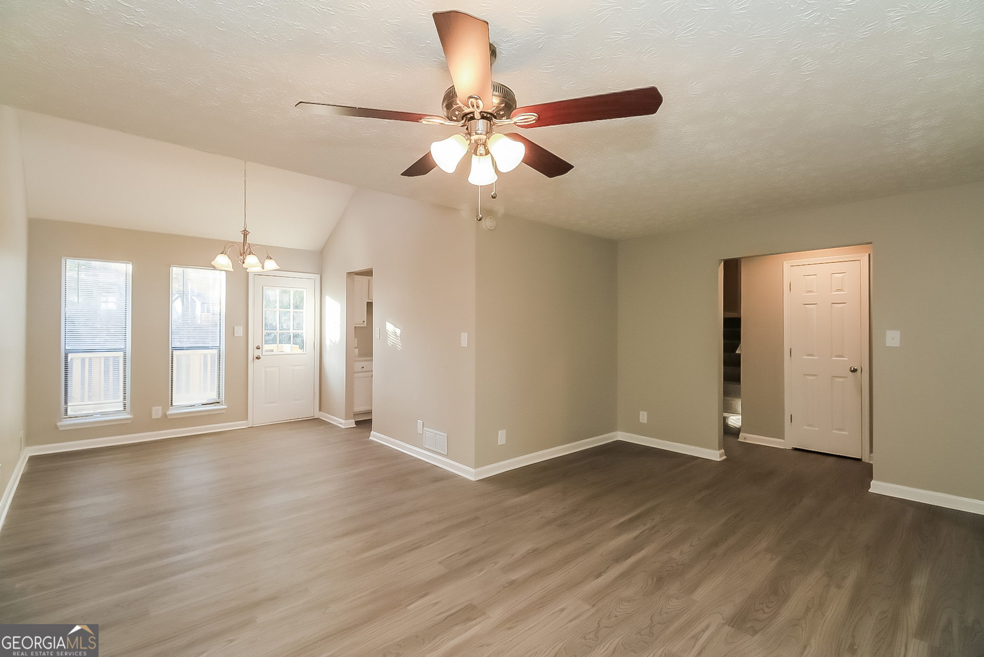 2875 Kathryn Circle Southwest Atlanta, GA 30331 - Photo 3 of 18 a view of an empty room with wooden floor and a window