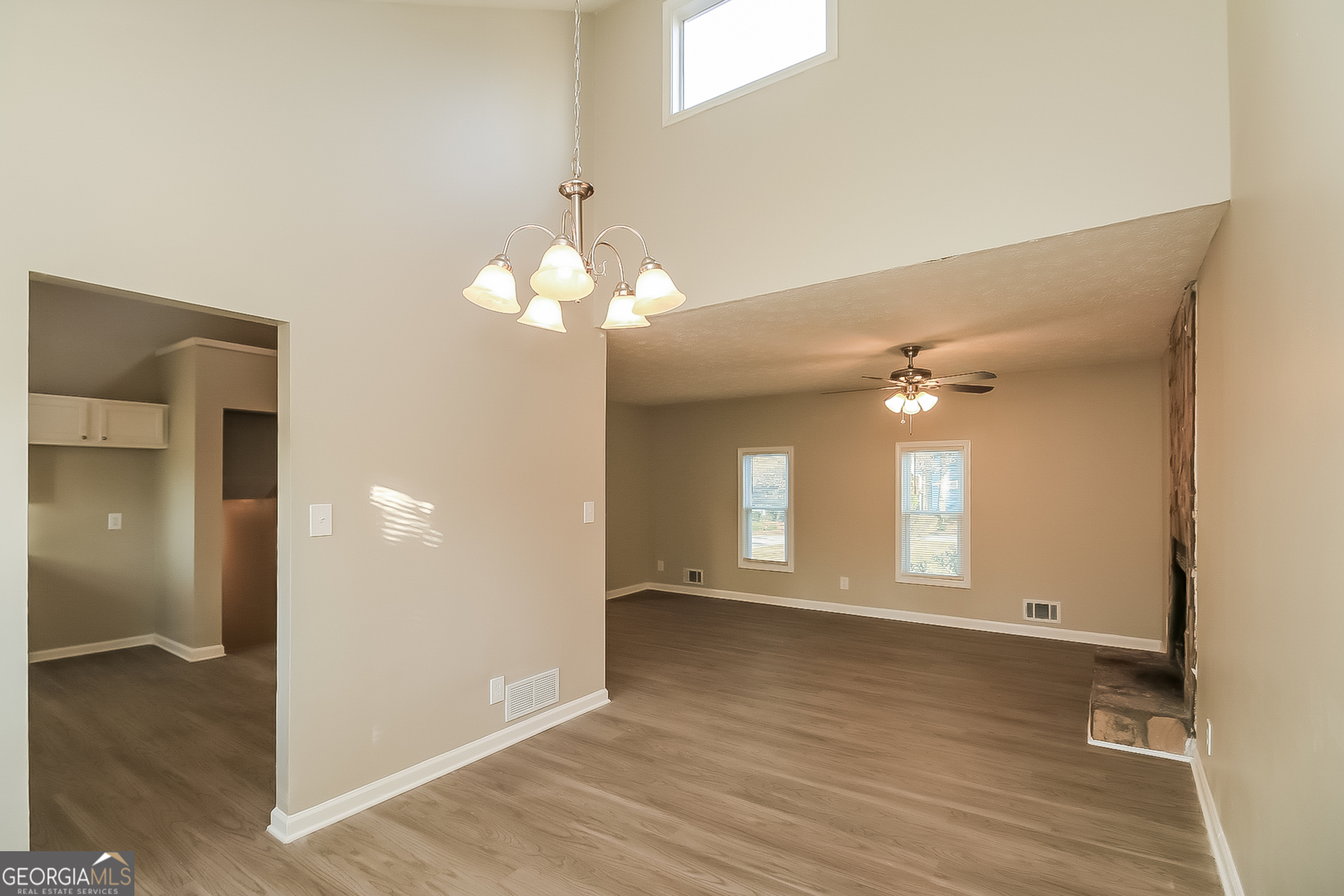 2875 Kathryn Circle Southwest Atlanta, GA 30331 - Photo 4 of 18 an empty room with wooden floor and windows
