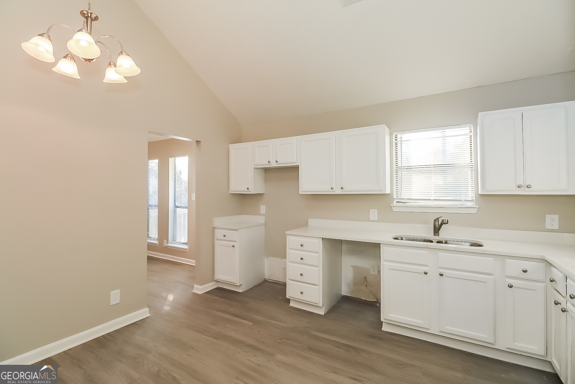 2875 Kathryn Circle Southwest Atlanta, GA 30331 - Photo 6 of 18 a kitchen with a sink cabinets and window