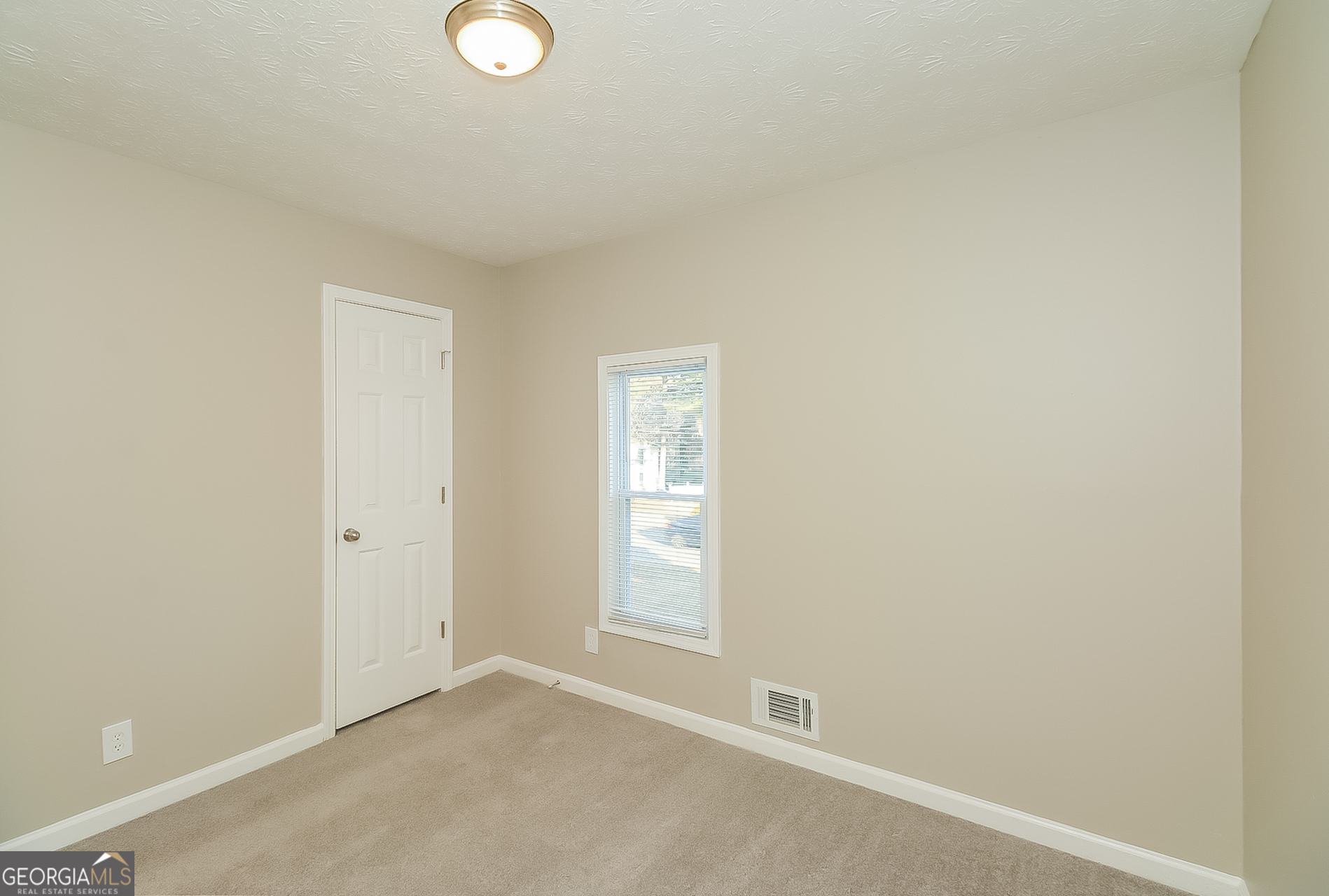 2875 Kathryn Circle Southwest Atlanta, GA 30331 - Photo 9 of 18 a view of an empty room with window and closet area