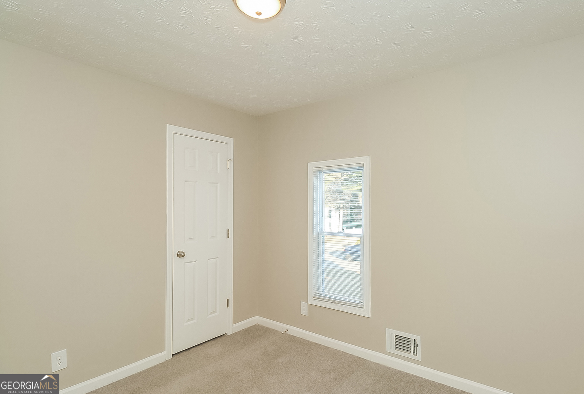 2875 Kathryn Circle Southwest Atlanta, GA 30331 - Photo 10 of 18 an empty room with windows