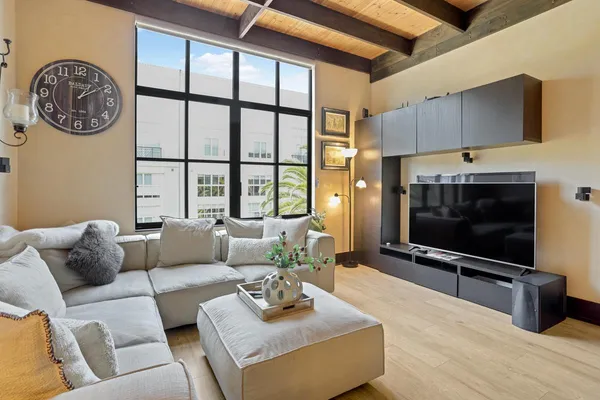a living room with furniture and a flat screen tv