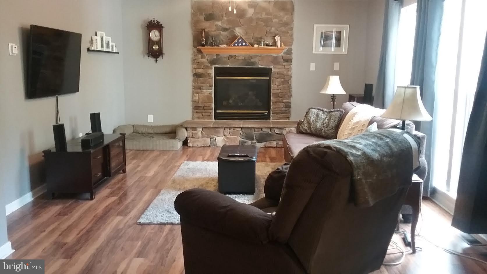 106 Stone Run Drive Rising Sun, MD 21911 - Photo 3 of 16 a living room with furniture and a flat screen tv