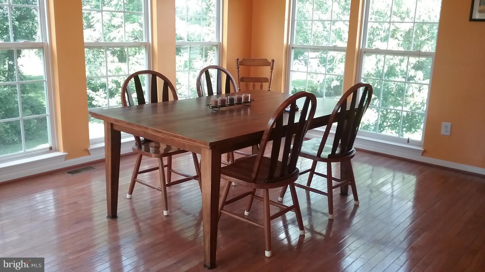 106 Stone Run Drive Rising Sun, MD 21911 - Photo 5 of 16 a view of a dining room with furniture window and wooden floor