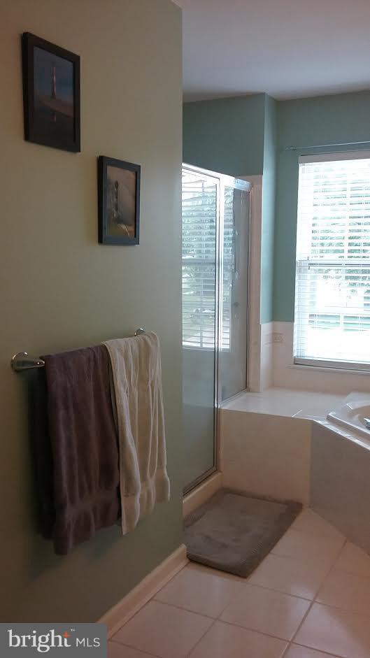 106 Stone Run Drive Rising Sun, MD 21911 - Photo 6 of 16 a bathroom with a bathtub and a window