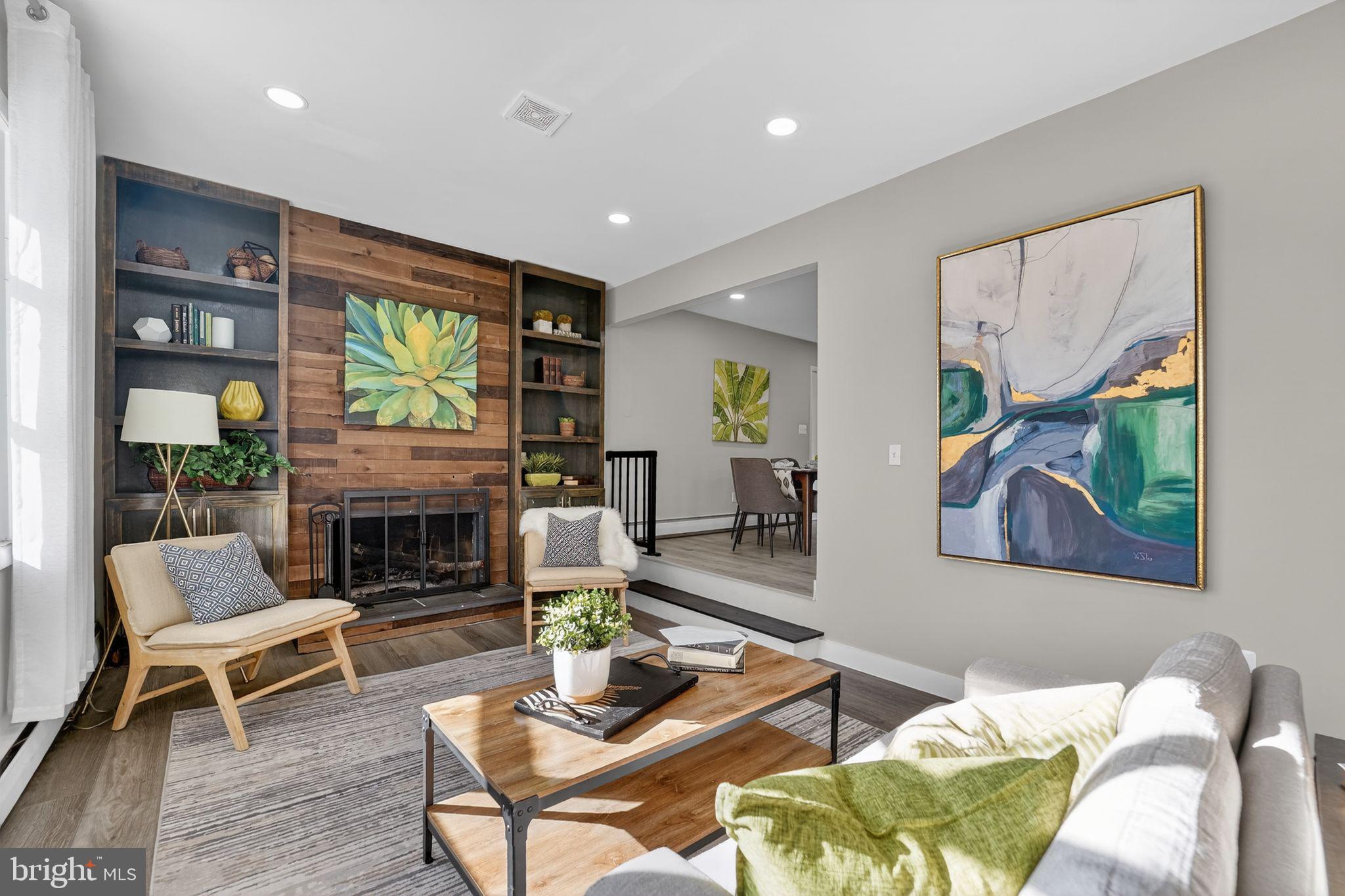 9337 Millbrook Road Ellicott City, MD 21042 - Photo 2 of 33 a living room with furniture and a fireplace