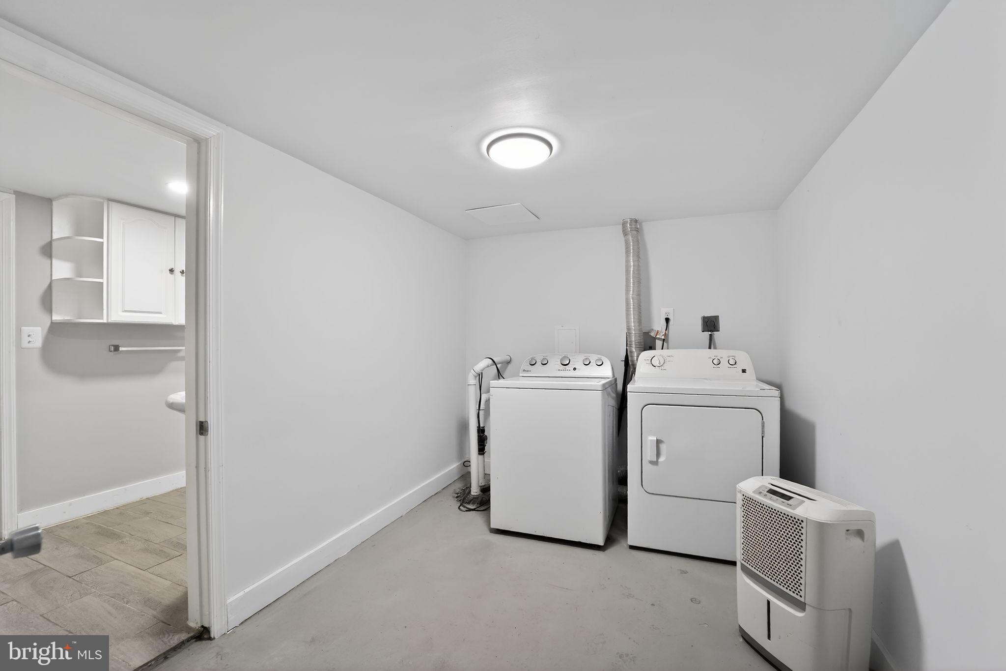 9337 Millbrook Road Ellicott City, MD 21042 - Photo 23 of 33 a utility room with dryer and washer