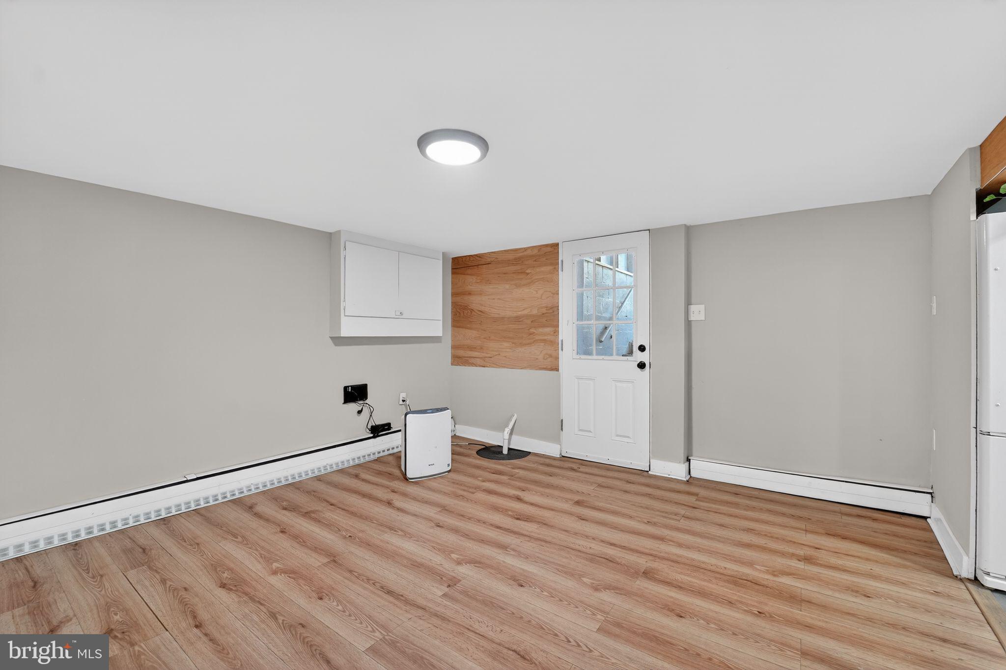 9337 Millbrook Road Ellicott City, MD 21042 - Photo 24 of 33 a view of empty room with wooden floor