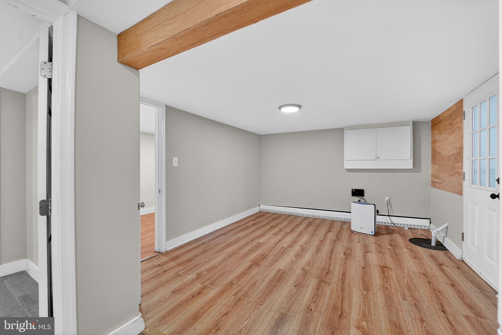 9337 Millbrook Road Ellicott City, MD 21042 - Photo 25 of 33 a view of empty room with wooden floor