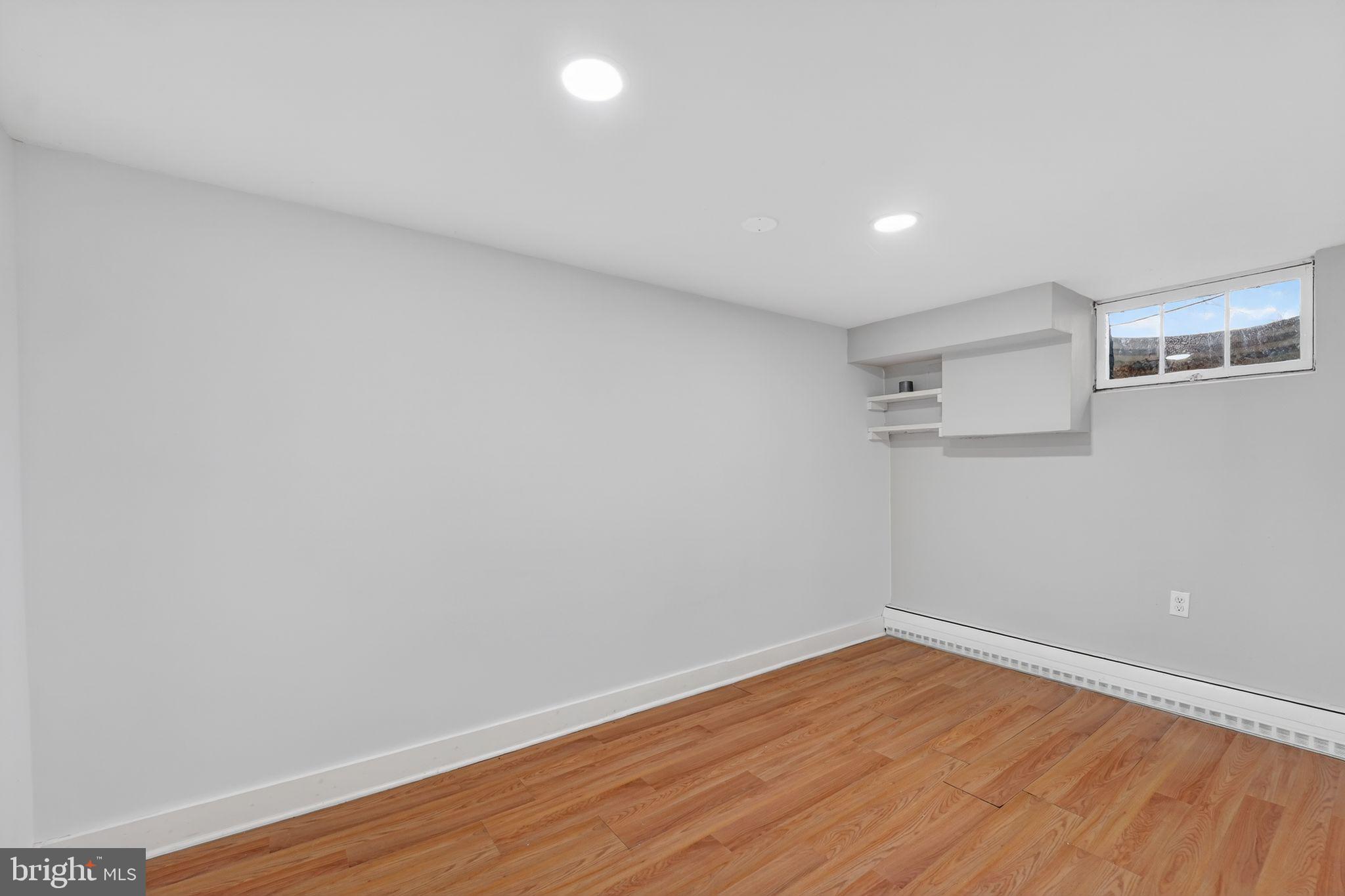 9337 Millbrook Road Ellicott City, MD 21042 - Photo 27 of 33 a view of empty room with wooden floor