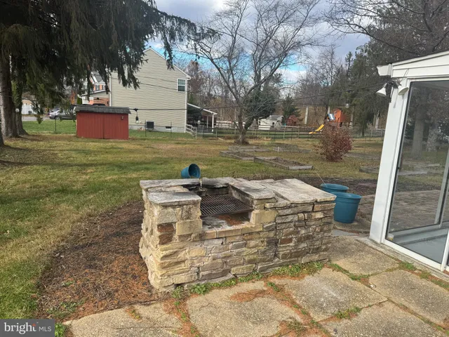 a view of a water fountain in the yard