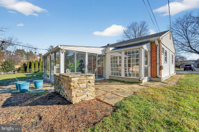 a house view with a sitting space and garden space