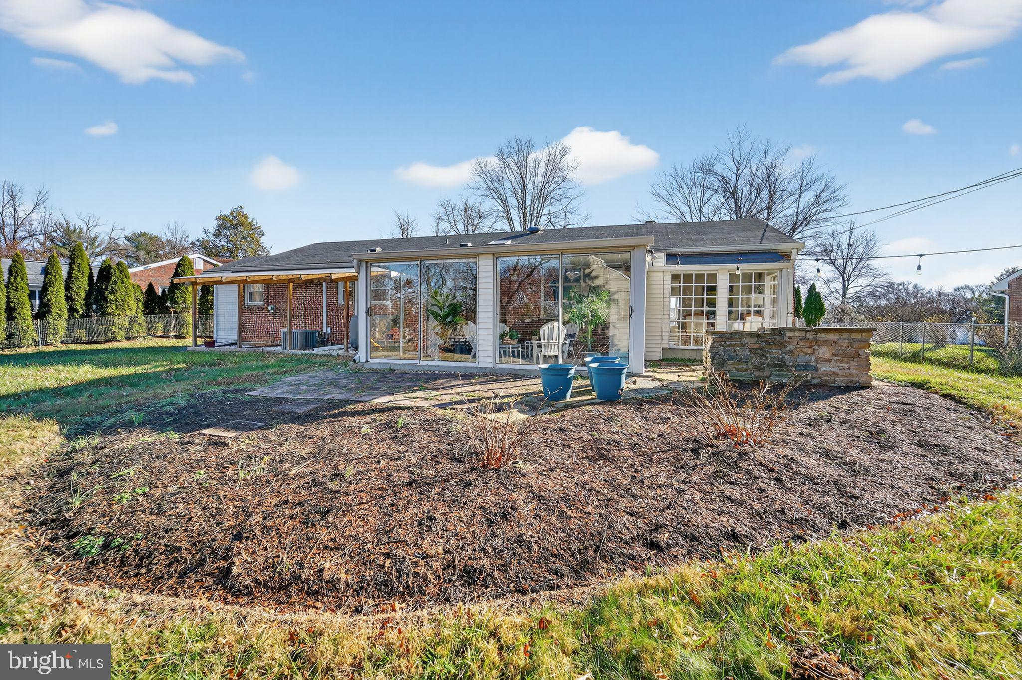 9337 Millbrook Road Ellicott City, MD 21042 - Photo 31 of 33 a view of a house with backyard and sitting area