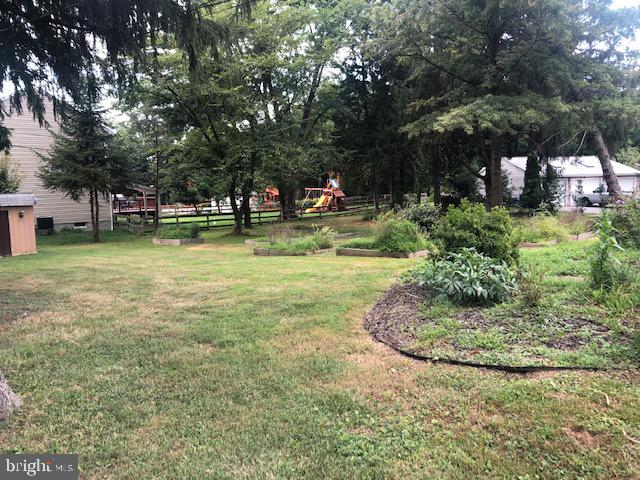 9337 Millbrook Road Ellicott City, MD 21042 - Photo 32 of 33 a view of a swimming pool with a bench