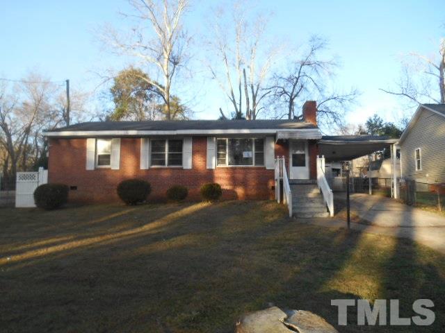432 Peyton Street Raleigh, NC 27610 - Photo 1 of 12 a front view of a house with a yard