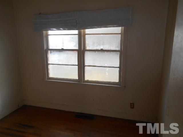 432 Peyton Street Raleigh, NC 27610 - Photo 11 of 12 an empty room with a window