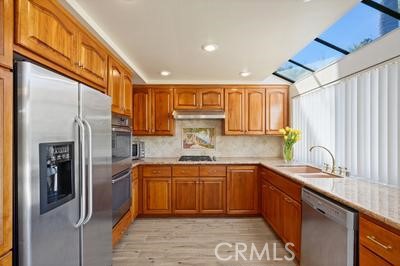 19565 Turtle Springs Way Porter Ranch, CA 91326 - Photo 5 of 96 Kitchen with granite counters
