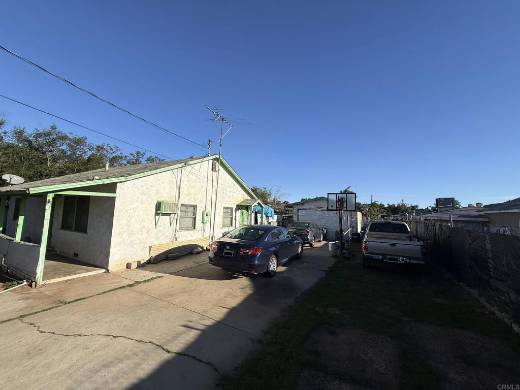 6929 37th Street Riverside, CA 92509 - Photo 4 of 13 a view of a car park in front of house