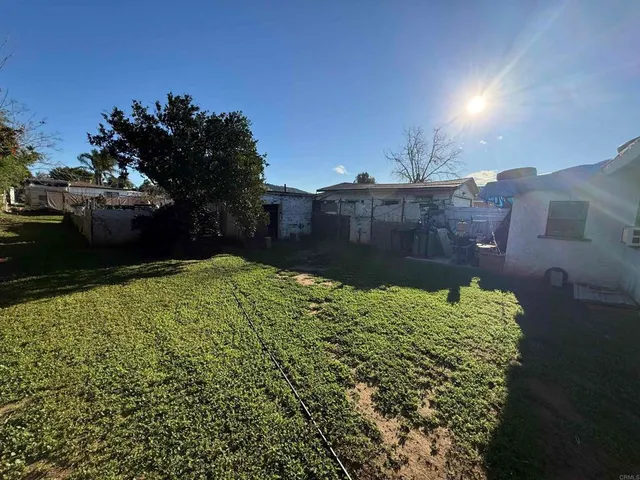 a view of a backyard of the house