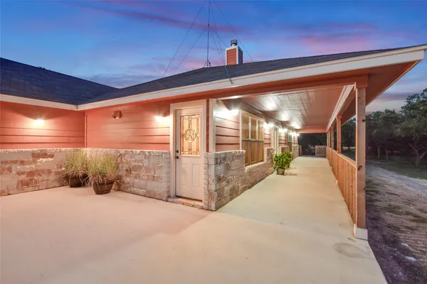 a house with trees in the background