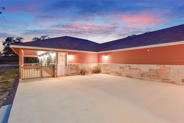 a aerial view of a house with a yard