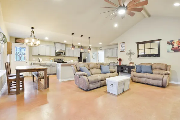 a living room with furniture and a fireplace