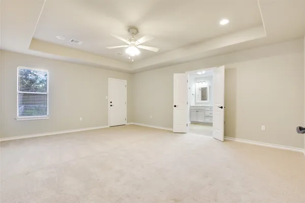 a bathroom with double sink and a mirror