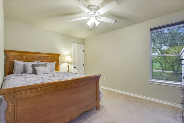 a bathroom with a granite countertop sink a toilet and a bathtub