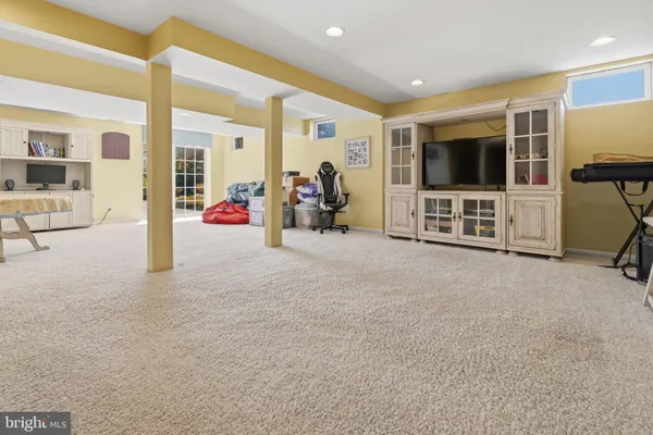 a view of a livingroom with furniture and a flat screen tv