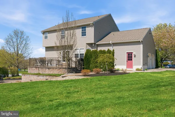 a front view of house with yard and outdoor seating