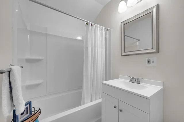 a bathroom with a sink a vanity and a mirror