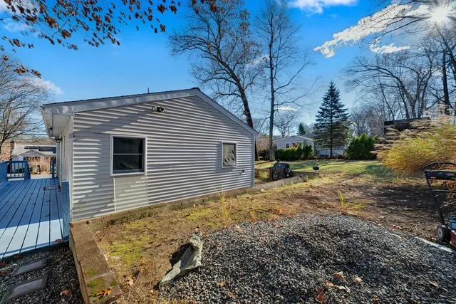 a view of a backyard with sitting area