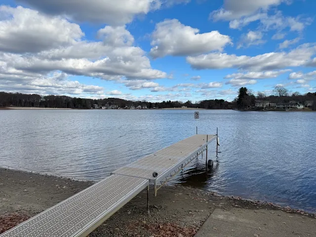 a view of a lake with outdoor seating