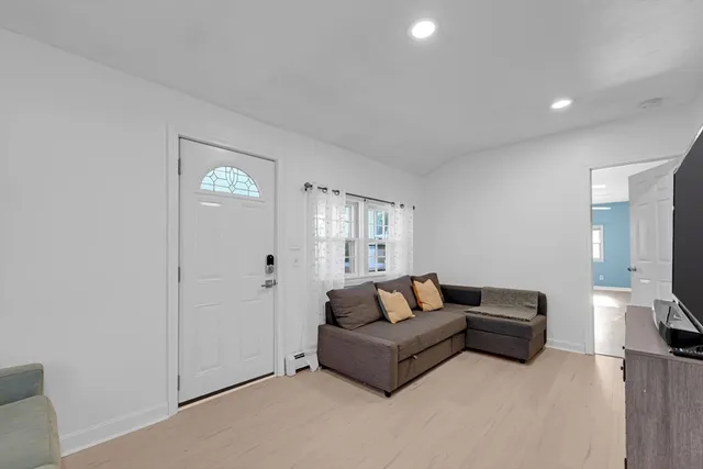 a living room with furniture and a gate