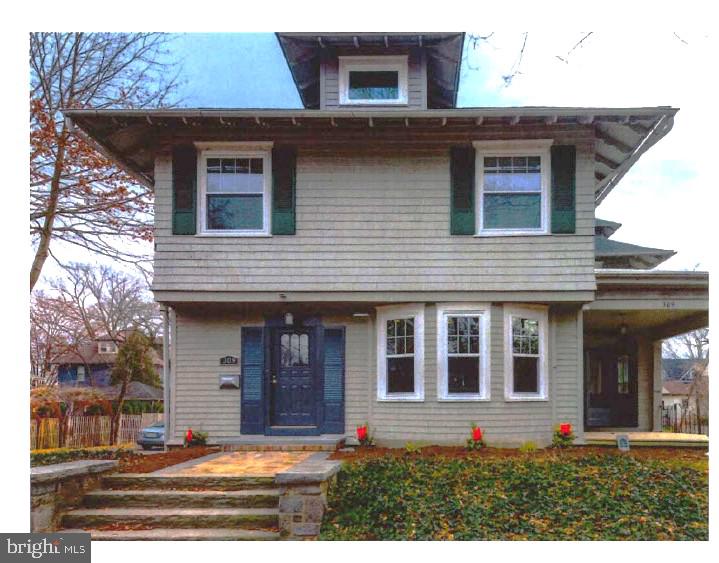 309-311 Warwick Road Haddonfield, NJ 08033 - Photo 1 of 12 a view of a house with more windows and a yard