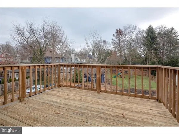a balcony with wooden floor