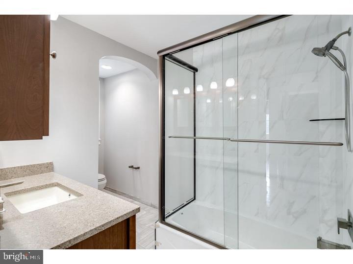 309-311 Warwick Road Haddonfield, NJ 08033 - Photo 7 of 11 a bathroom with a sink and a mirror