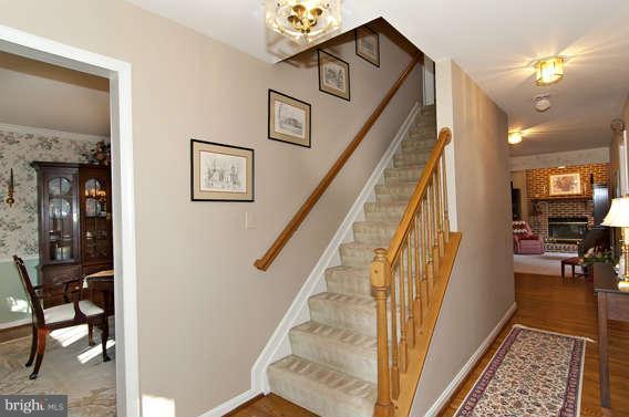 3721 Ligon Road Ellicott City, MD 21042 - Photo 14 of 30 a view of a hallway to a livingroom with furniture and entryway