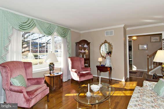 3721 Ligon Road Ellicott City, MD 21042 - Photo 15 of 30 a living room with furniture chandelier and a table