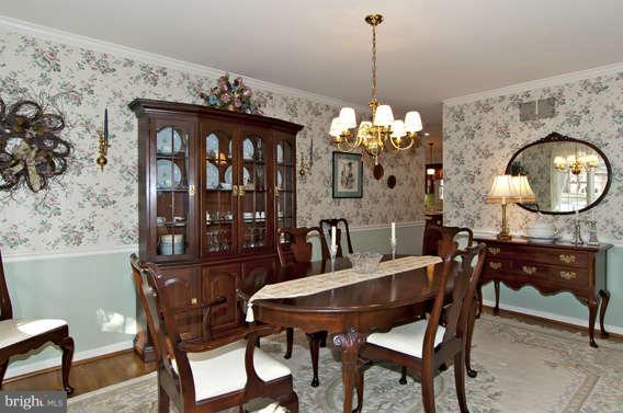 3721 Ligon Road Ellicott City, MD 21042 - Photo 16 of 30 a view of a dining room with furniture and chandelier