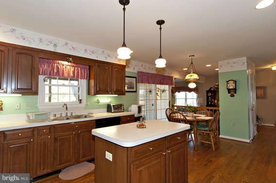 3721 Ligon Road Ellicott City, MD 21042 - Photo 18 of 30 a kitchen with a sink a counter space appliances and cabinets