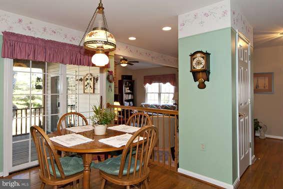 3721 Ligon Road Ellicott City, MD 21042 - Photo 20 of 30 a view of a dining room with furniture window and wooden floor