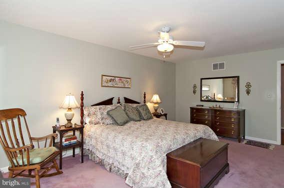 3721 Ligon Road Ellicott City, MD 21042 - Photo 22 of 30 a bedroom with a bed and a flat screen tv
