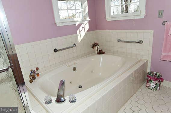 3721 Ligon Road Ellicott City, MD 21042 - Photo 23 of 30 a bathroom with a tub sink and a window