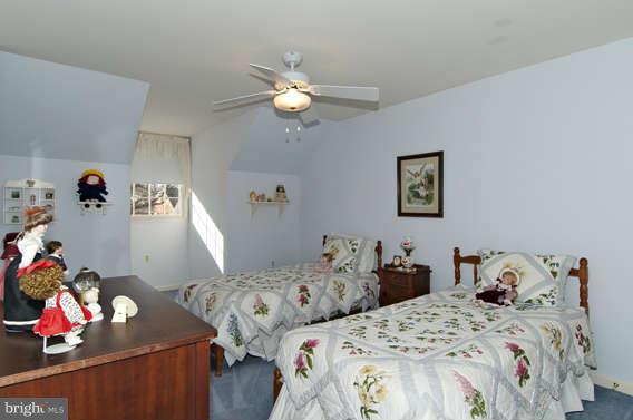 3721 Ligon Road Ellicott City, MD 21042 - Photo 25 of 30 a bedroom with two beds and a chandelier
