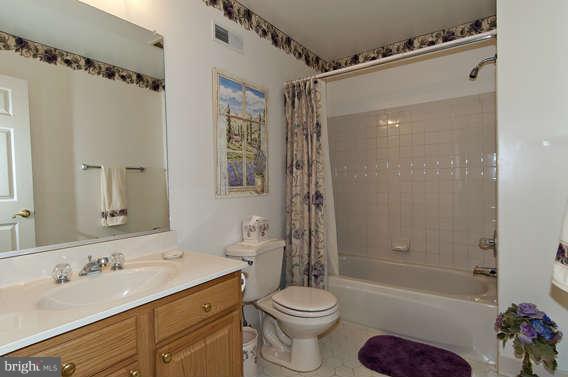 3721 Ligon Road Ellicott City, MD 21042 - Photo 26 of 30 a bathroom with a sink toilet tub and shower