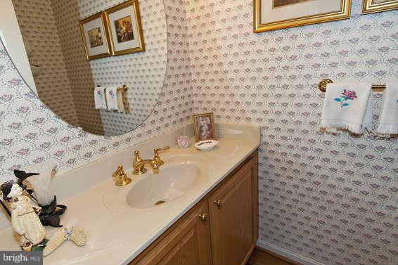 3721 Ligon Road Ellicott City, MD 21042 - Photo 27 of 30 a bathroom with a sink and a mirror