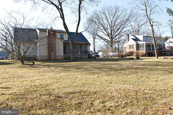 3721 Ligon Road Ellicott City, MD 21042 - Photo 29 of 30 a brick house with a large tree in front of it